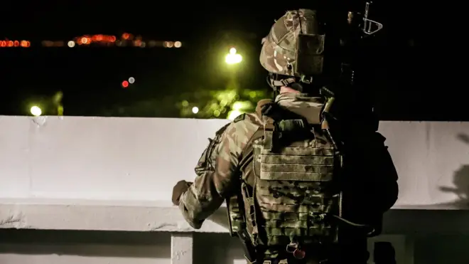 Royal Marine on the bridge of Grace 1