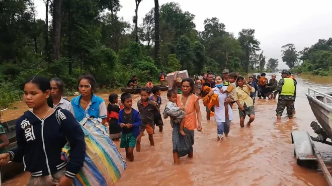 Villagers rescued from flooding after dam collapses. 24 July 2018
