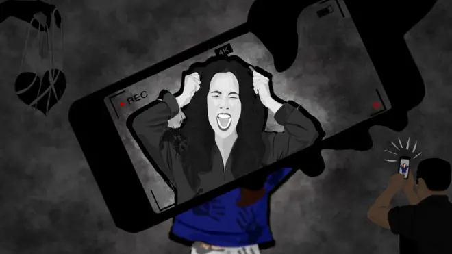 A woman screams and pulls at her hair as a mobile phone screen hovers over her.