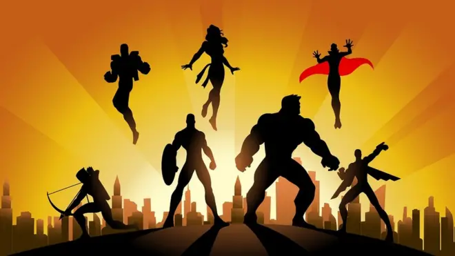 A silhouette style illustration of a team of superheroes in action pose with city skyline in the background.