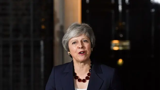 Theresa May talking to the media in front of 10 Downing Street