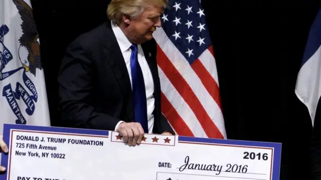Trump presents a cheque