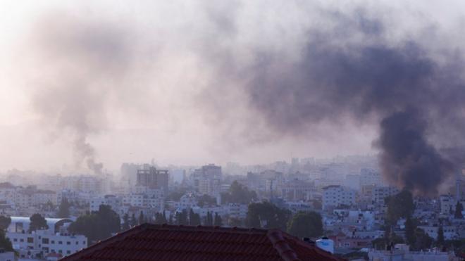 Smoke rises during an Israeli military operation, at a hospital in Jenin