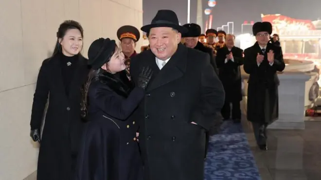 Kim Jong Un attends a military parade with his wife Ri Sol Ju (left) and their daughter Kim Ju Ae (centre)