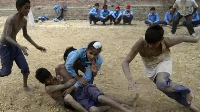 Indian schoolchildren play kabaddi at their school in the village of Sarai Amanat Khan, about 30km west of Amritsar.
