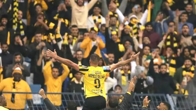 Morocco's Abderrazak Hamdallah celebrates with Al-Ittihad fans after scoring for them in January 2023