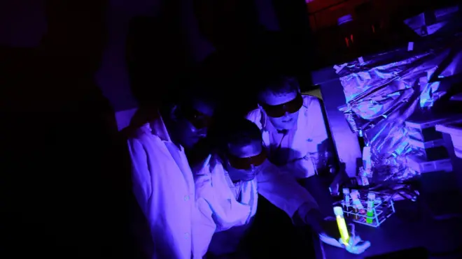 Dr. Ajith Karunarathne, Dr. John Payton and graduate student Kasun Ratnayake are examining reactions between blue light and retinal in a light proof laboratory at the University of Toledo