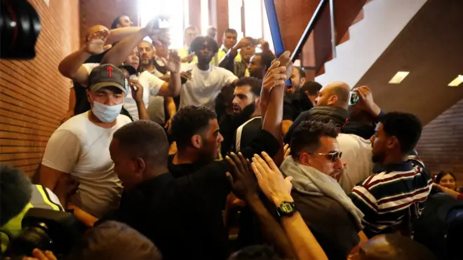 Between 50 and 60 protesters rushed into the council building.