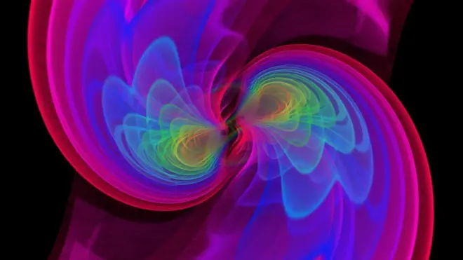 Esta imagen muestra una simulación de las ondas gravitacionales que irradia la fusión de dos agujeros negros.