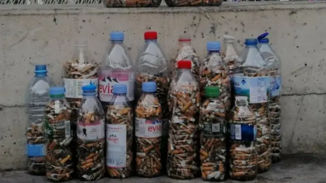 Cigarettes collected in a plastic bottle
