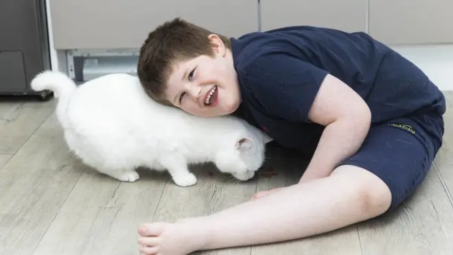 Minty the cat and six-year-old Connor are best friends