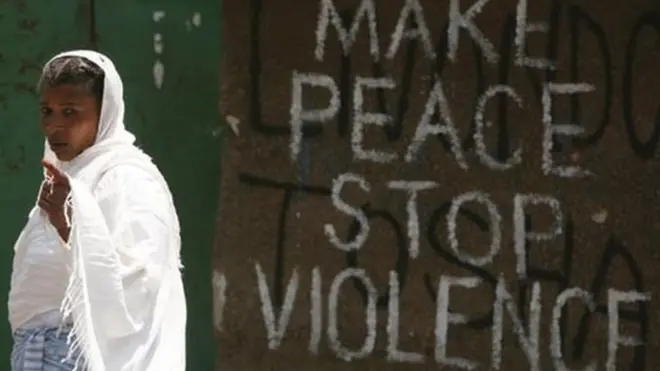 Writing of "Make Peace Stop Violence" for wall.