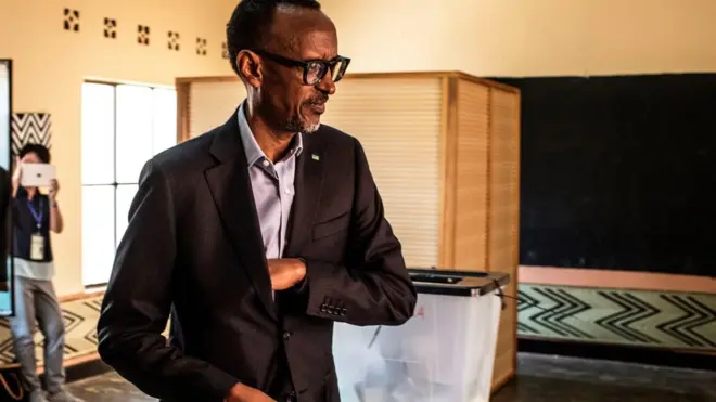 Rwandan President Paul Kagame arrives to cast his vote at a polling station in Kigali, 4 August