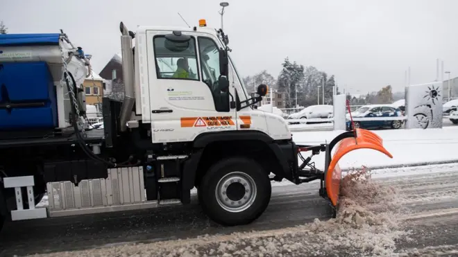 A snow plough in action in Brussels