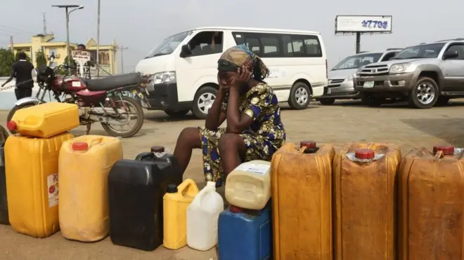 Woman siddon for fuel queue.