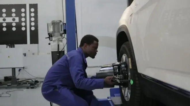 man working in a car factory