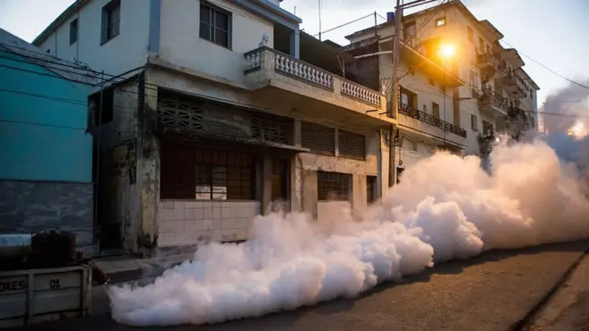 2016: Cuban health authorities and the army fumigate a street in Havana
