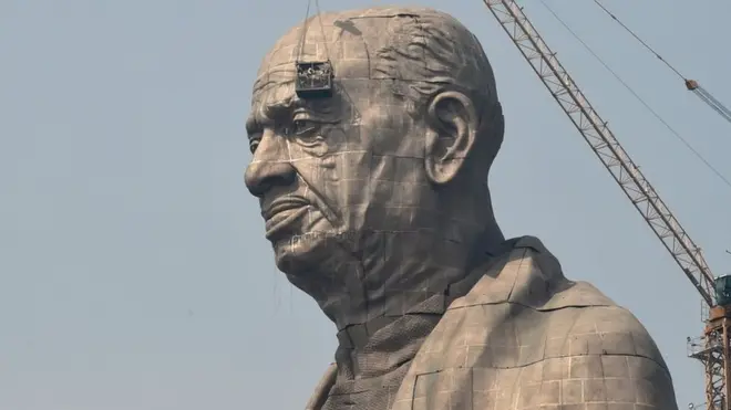 Indian workers give the finishing touches to the world's tallest statue dedicated to Indian independence leader Sardar Vallabhbhai Patel in India's western Gujarat state.