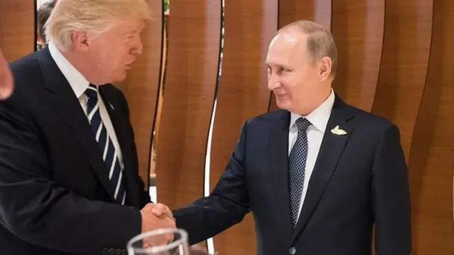Trump and Putin shake hands