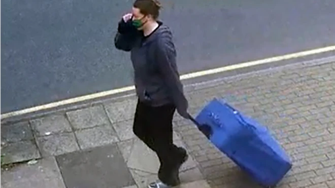 The blue suitcase Mitchell took to Ms Chong's flat was used to transport her body, the prosecution said