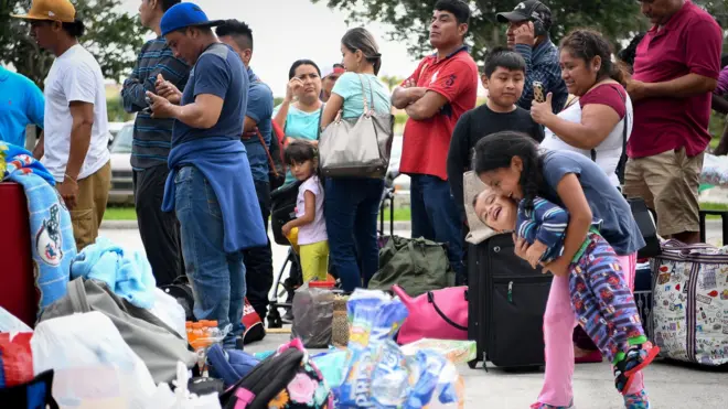 People queue for shelters