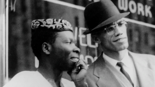 L-R: Babatunde Olatunji and Malcolm X at an event in Harlem, New York, the US - 1 October 1960