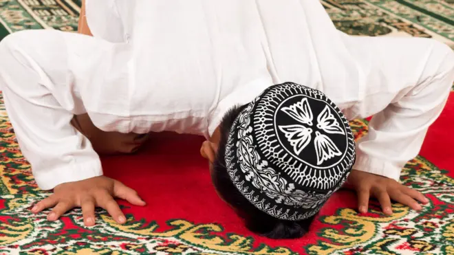Young Muslim praying