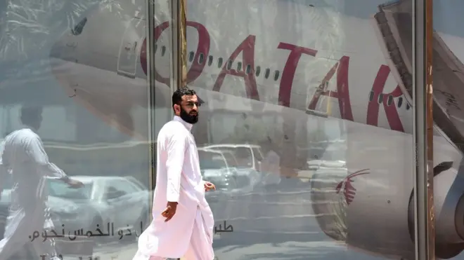 A man walks past the Qatar Airways branch in the Saudi capital Riyadh, 5 June