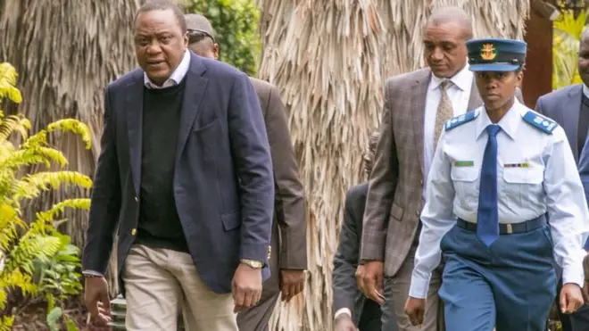 President Uhuru Kenyatta and im first female assistant Aide-de-Camp Rachel Nduta Kamui.