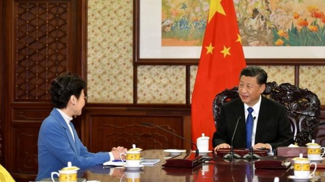 A handout photo made available by Hong Kong Government"s Information Services Department (ISD) shows Hong Kong Chief Executive Carrie Lam (L) with Chinese President Xi Jinping (R) during their meeting in Beijing, China, 16 December 2019.