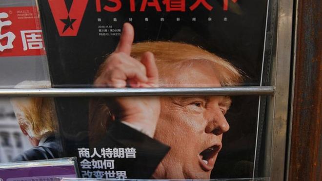 A magazine featuring a cover story about US President-elect Donald Trump is seen at a news stand in Beijing on November 23, 2016.