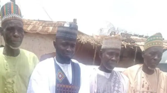 The groom pictured with wedding guests