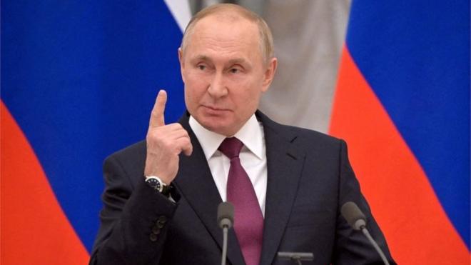 Russian President Vladimir Putin gestures during a joint news conference with German Chancellor Olaf Scholz in Moscow, Russia February 15, 2022
