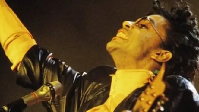 Prince performing onstage in 1987 in Paris