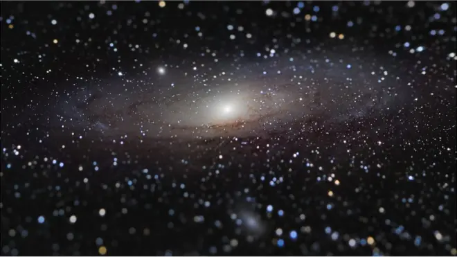 A photo of Andromeda galaxy with a tilt shift effect making the galaxy appear close