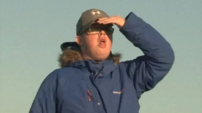 Calum looks up to the skies as an aircraft approaches the Graveyard at Glasgow Airport