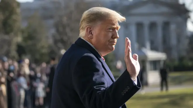 President Donald Trump waves as he walks to Marine One on the South Lawn of the White House on 12 January