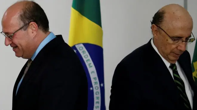 lan Goldfajn (L), president appointed to the Central Bank, is seen near Finance Minister Henrique Meirelles (R) during a meeting at the Planalto Palace in Brasilia