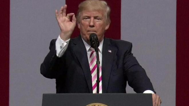 Donald Trump gestures at the camera