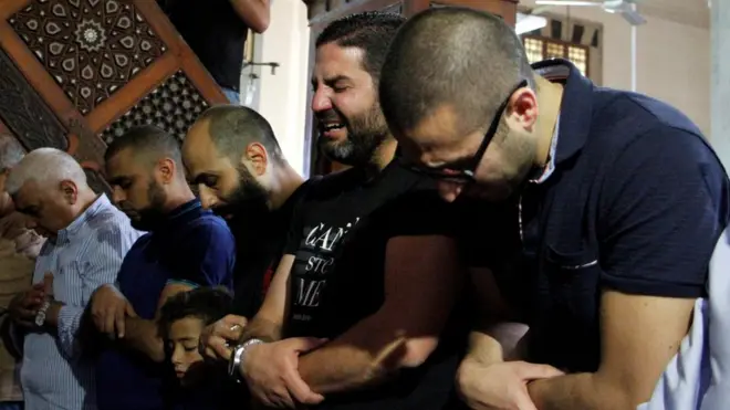 Relatives of the victims of the missing EgyptAir flight MS804 hold an absentee funeral prayer in a mosque nearby Cairo airport, in Cairo Egypt May 20, 2016