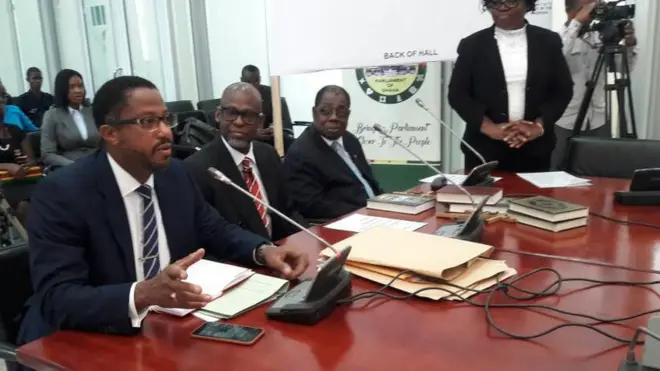 Lawyer Charles W. Zwennes den Ashim Morton President of the Millennium Excellence Foundation as de, appear before committee yestee