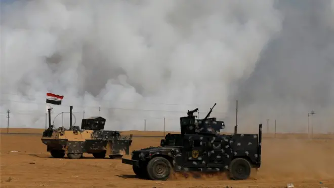 Smoke rises from the burning sulphur plant at Mishraq, near Mosul, 21 October