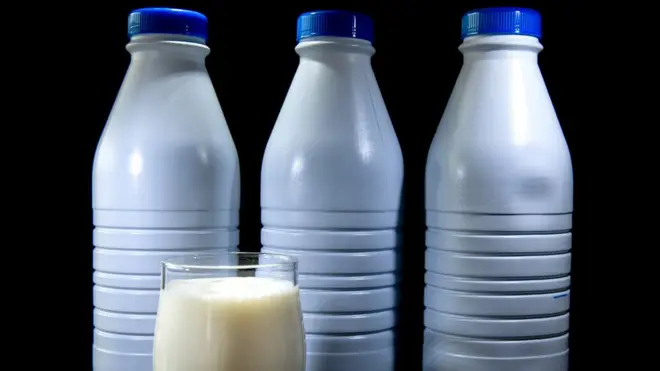 Cup and bottle of milk