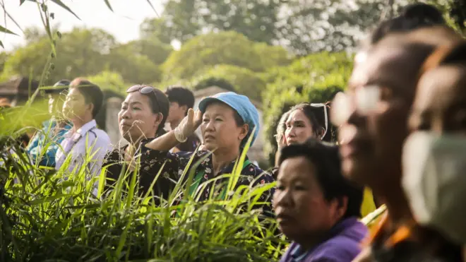 Onlookers watch as helicopter leaves cave entrance - 9 July