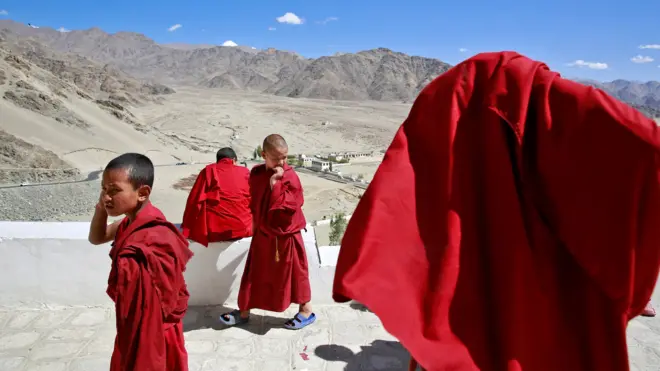 Young monks take a break from their studies inside Thiksey Monastery in Ladakh, India.