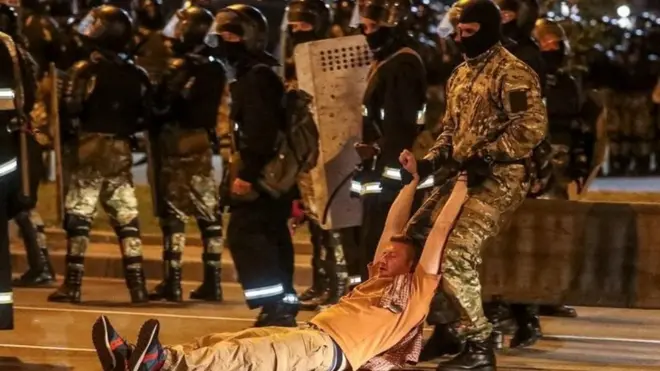 One protester was seen being dragged away by police in Minsk