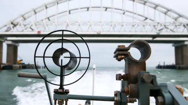 A patrol boat of the coast guard of the Border Service under the Russian Federal Security Service approaches the Kerch Strait Bridge linking the Crimean Peninsula and mainland Russia