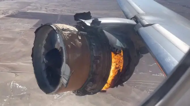 The plane's engine in flames filmed from the passenger window.