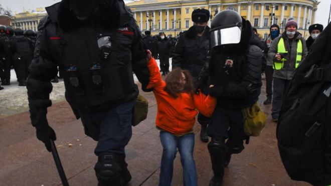 Riot police detain a protester during a rally in support of jailed opposition leader Alexei Navalny in Saint Petersburg on 23 January 2021.