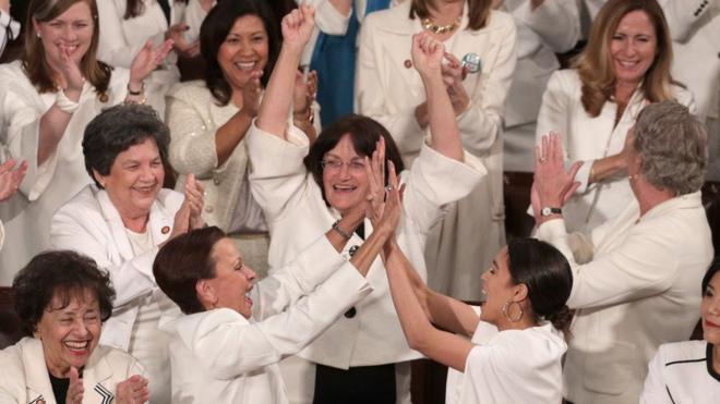Democratic women cheer during Trump's State of the Union speech